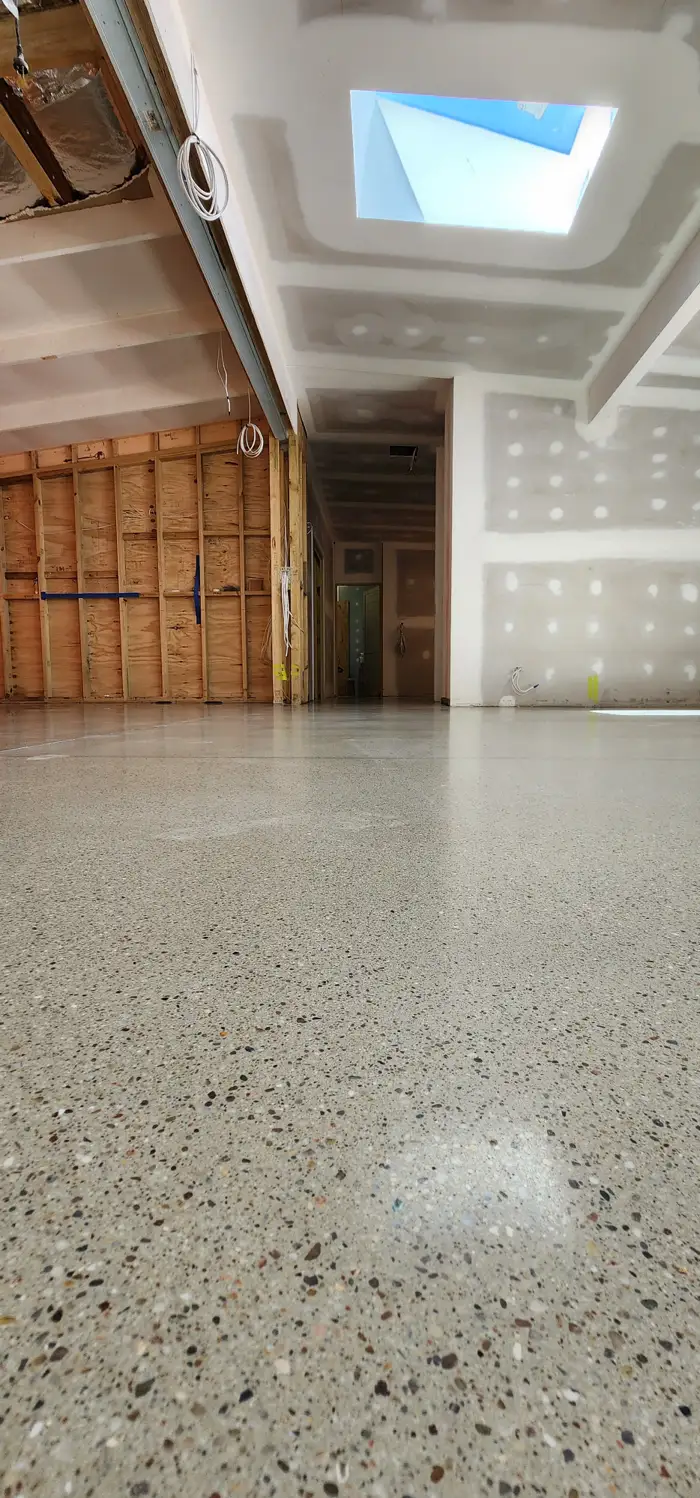 Poured terrazzo floor across an open living space in an Avalon Beach home