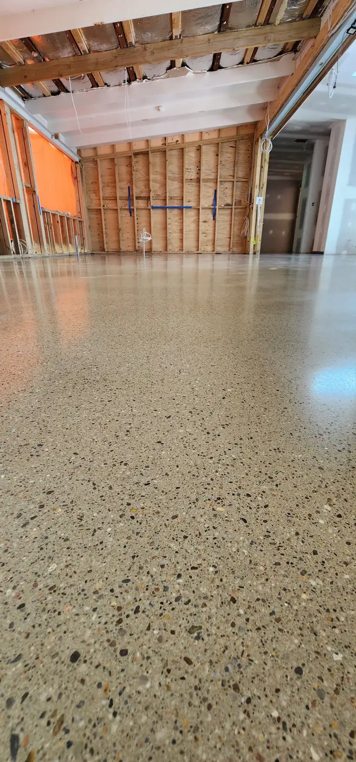 Terrazzo floor being ground and polished on-site in an Avalon Beach home