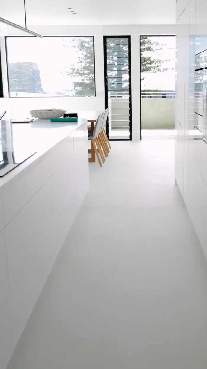 Seamless microcement surface running through a styled Avalon living space