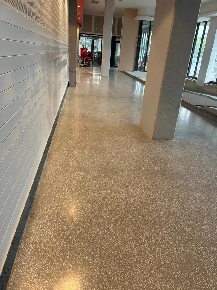 Satin-finish polished terrazzo overlay at Coles Caringbah