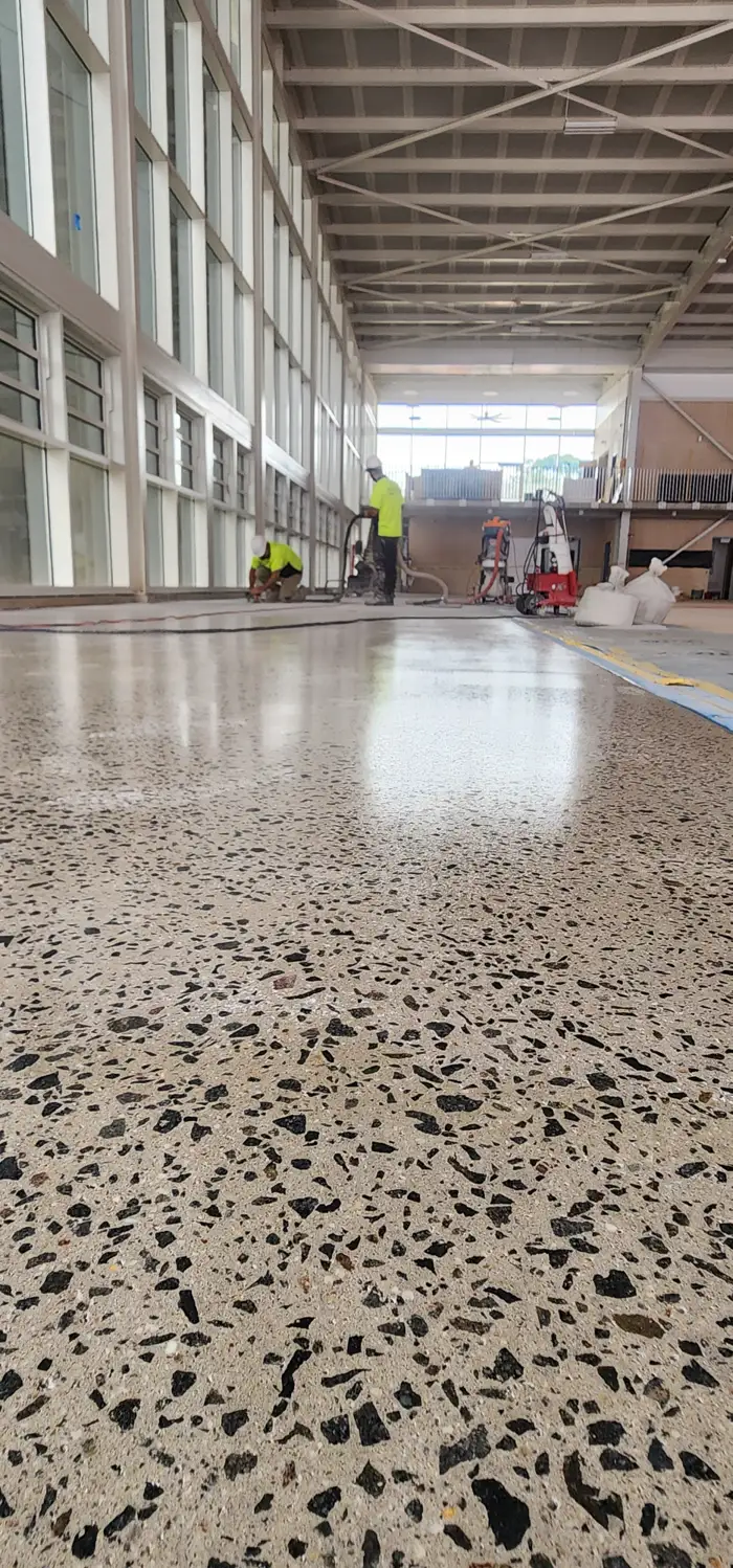Ground-and-sealed concrete floor down the length of a West Ryde warehouse