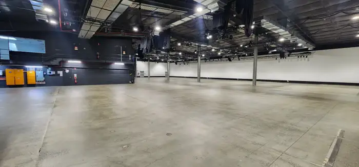 Grind-and-seal polished concrete floor across a large open space