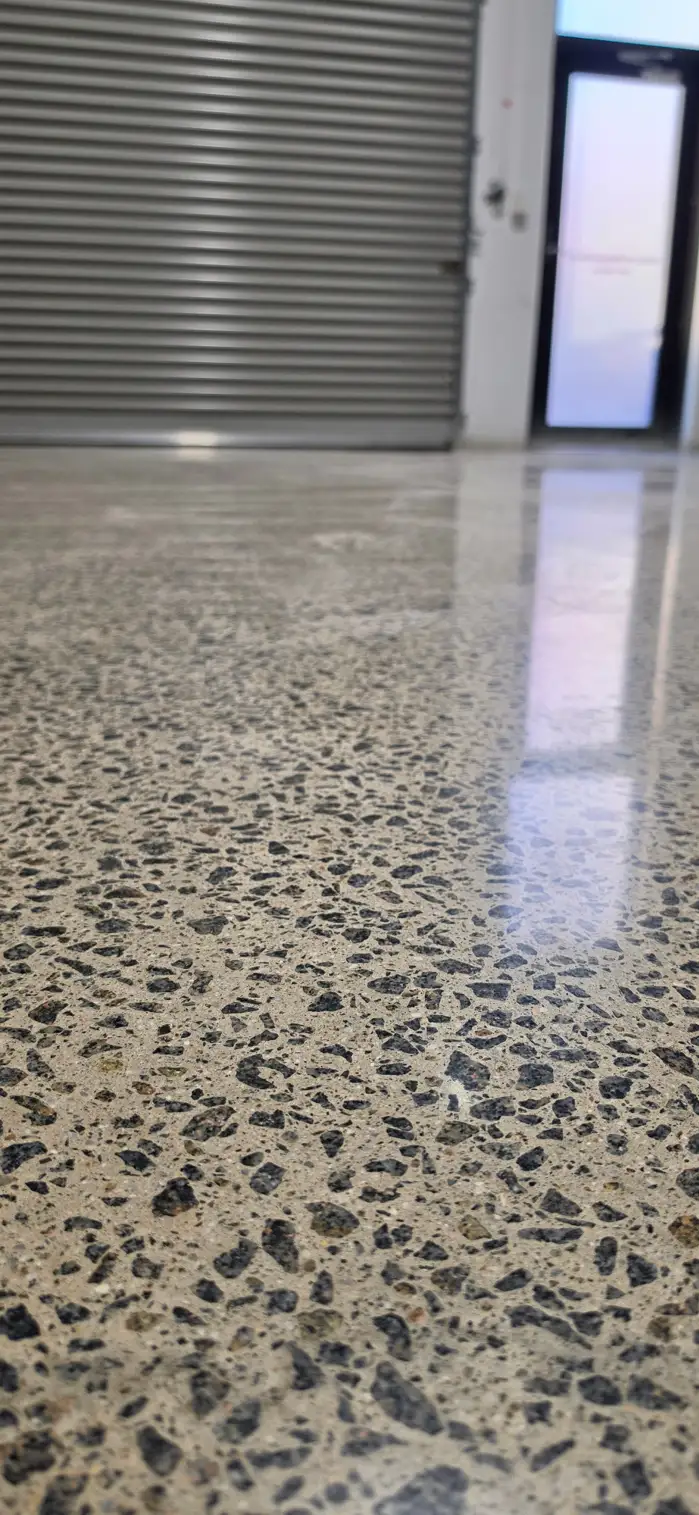 Mechanically polished concrete floor with exposed aggregate at the Nextone Lane Cove showroom