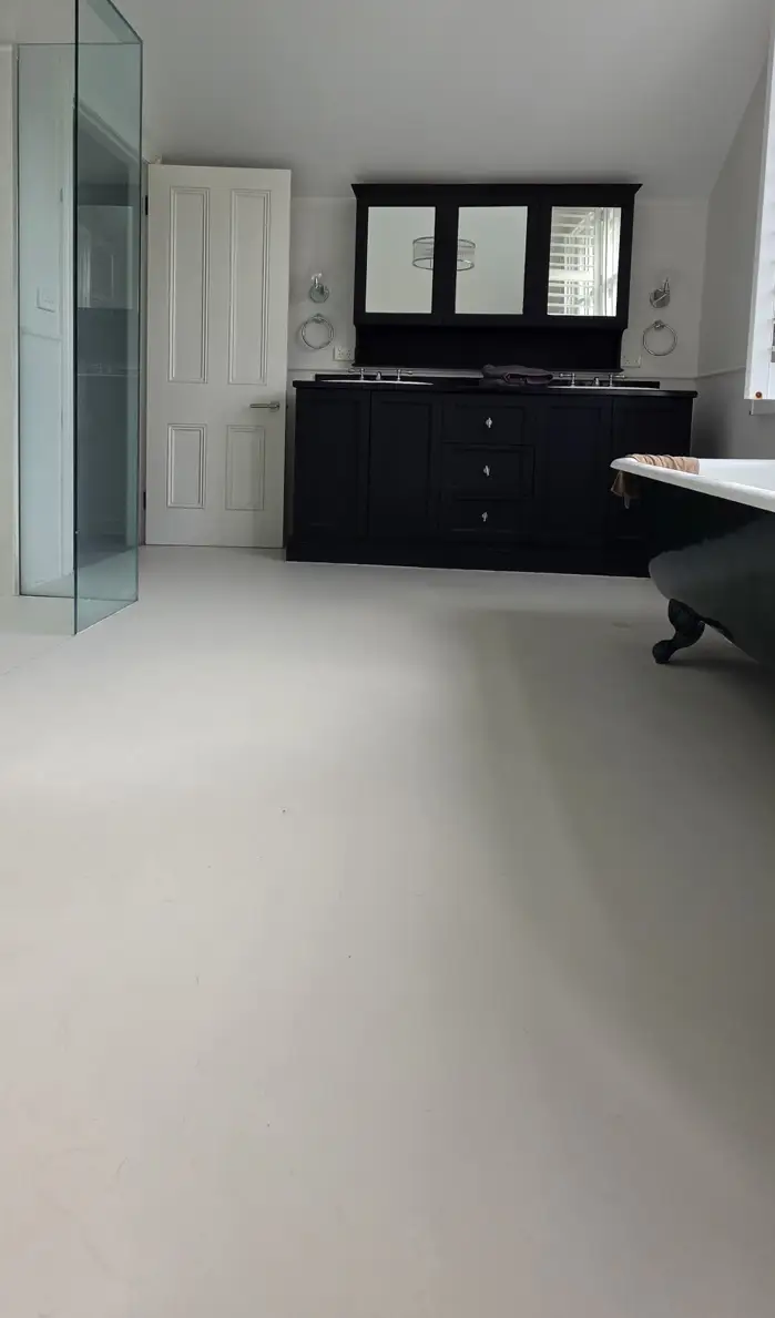 Seamless, grout-free microcement floor in a finished Manly bathroom