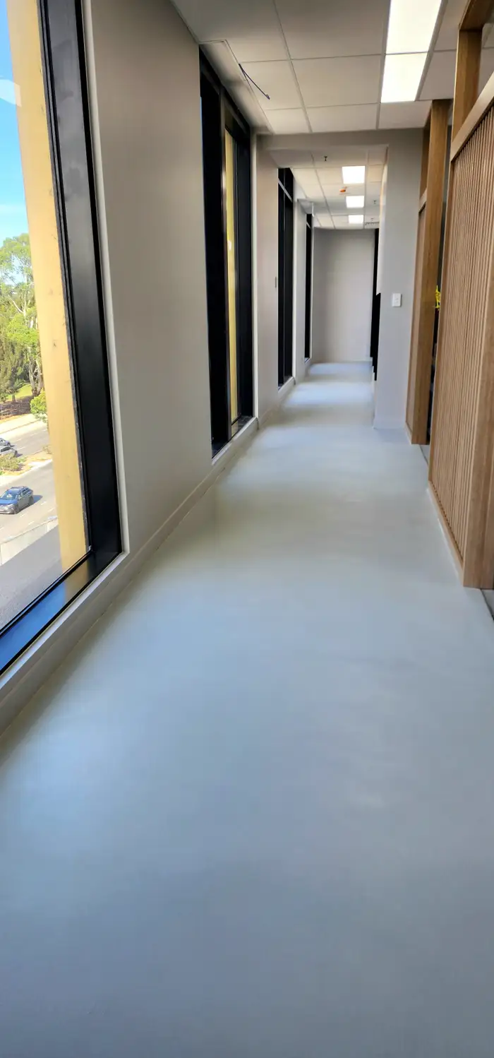 Hard-wearing seamless microcement surface in a Woolooware fit-out