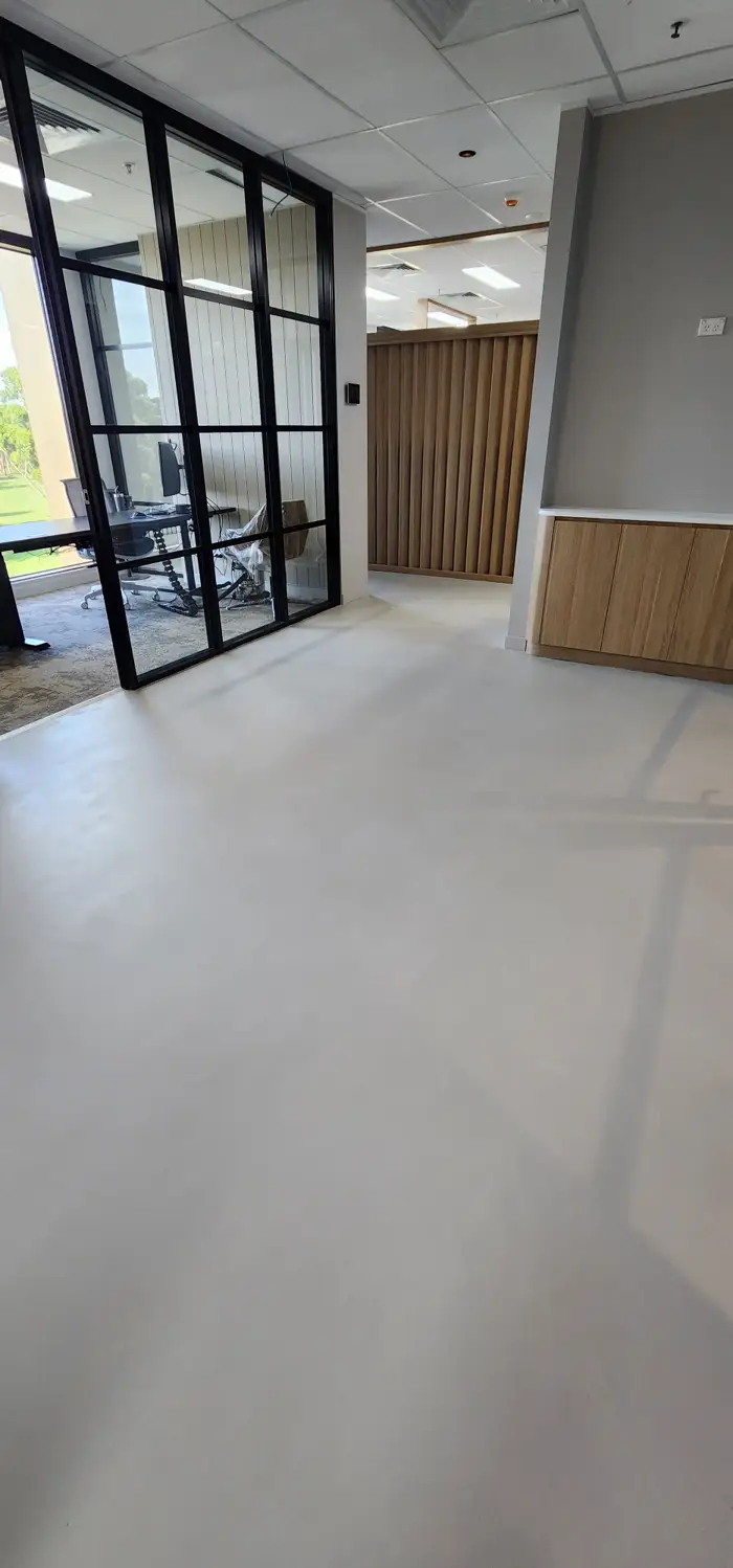 Seamless microcement floor across a Woolooware commercial space
